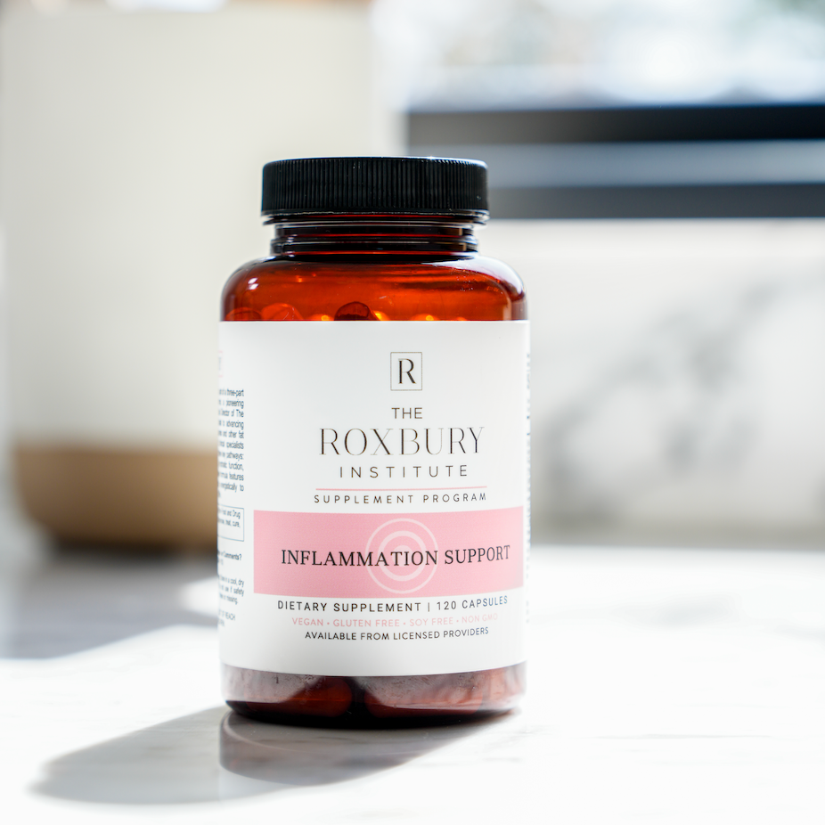 'The Roxbury Institute' supplement bottle labeled 'Inflammation Support' on a counter with blurred background